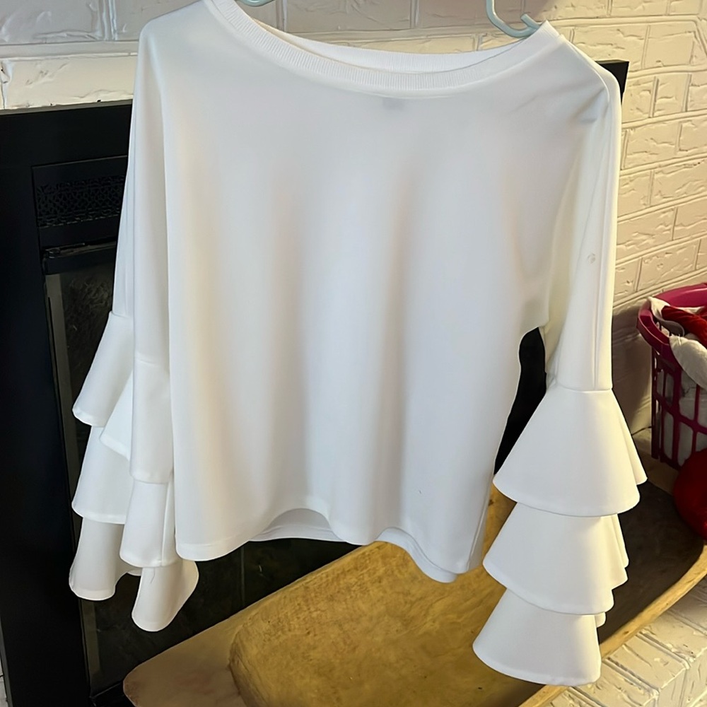 White ruffle sleeved top. .  Worn for my daughter’s wedding morning breakfast.